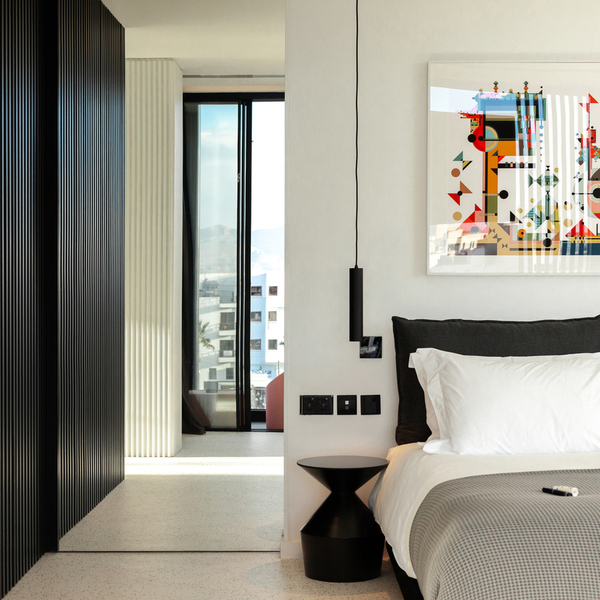 Modern room at MAP Boutique Hotel in Nicosia, Cyprus, with a design bed, bold artwork and a city balcony